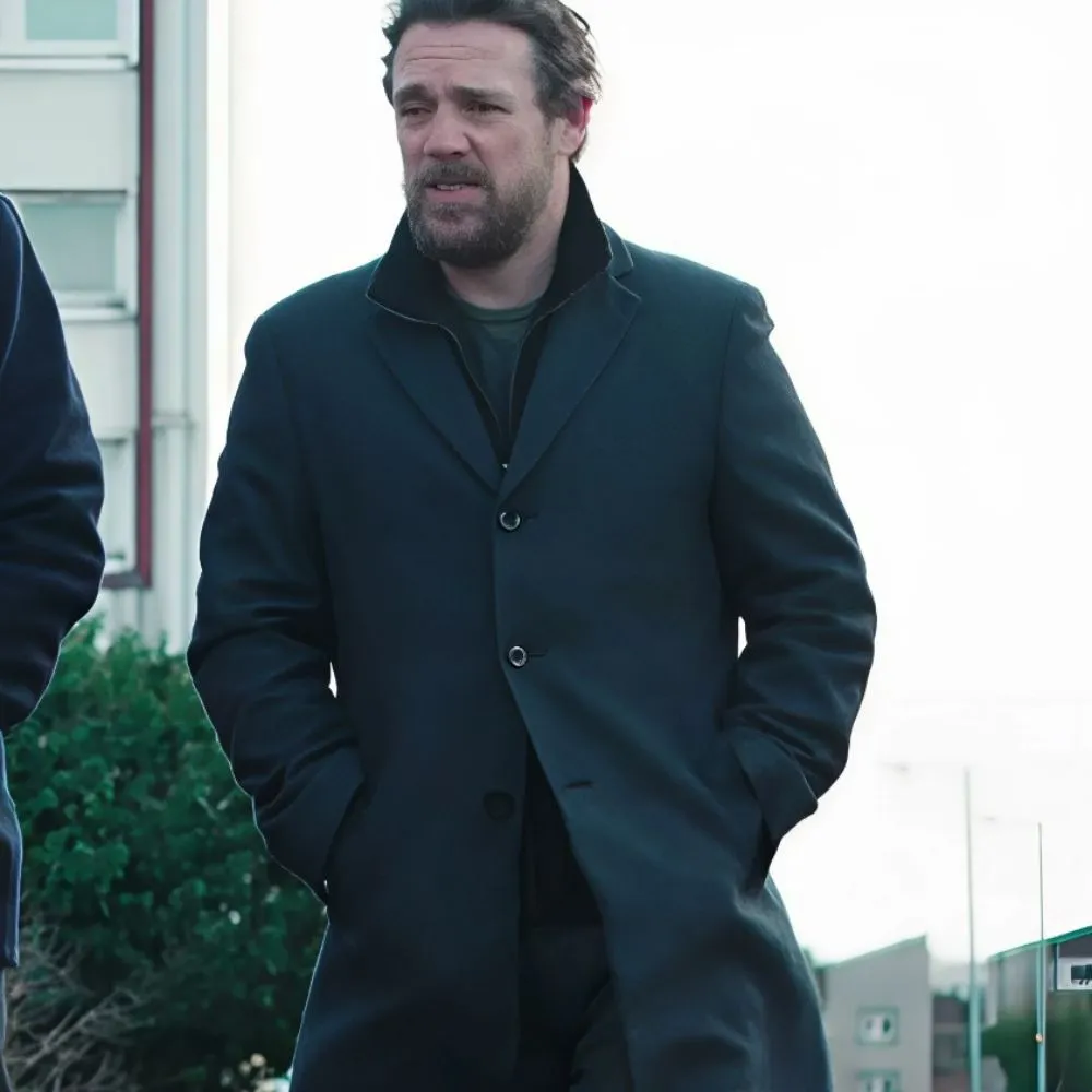 dept-q-jamie-sives-black-coat.webp