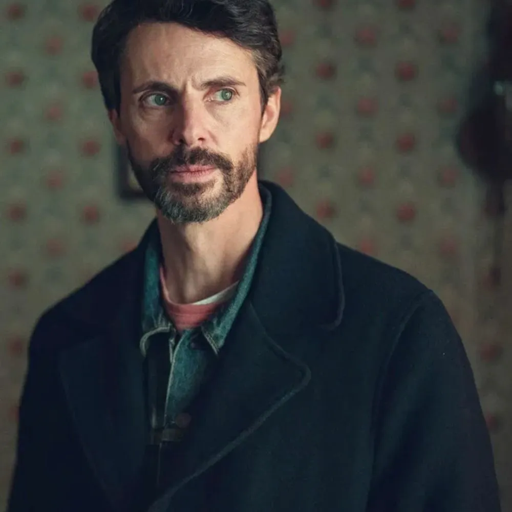 dept-q-s01-matthew-goode-black-coat.webp