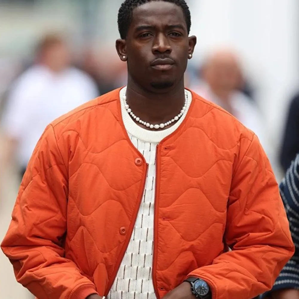 f1-movie-damson-idris-orange-jacket.webp